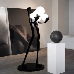 Sculpture holding ball floor lamp